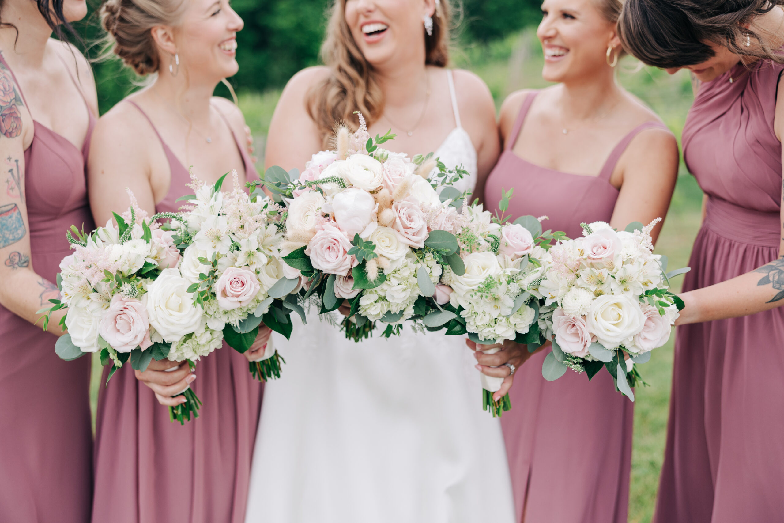 Bridesmaids laughing by Virginia Wedding Company