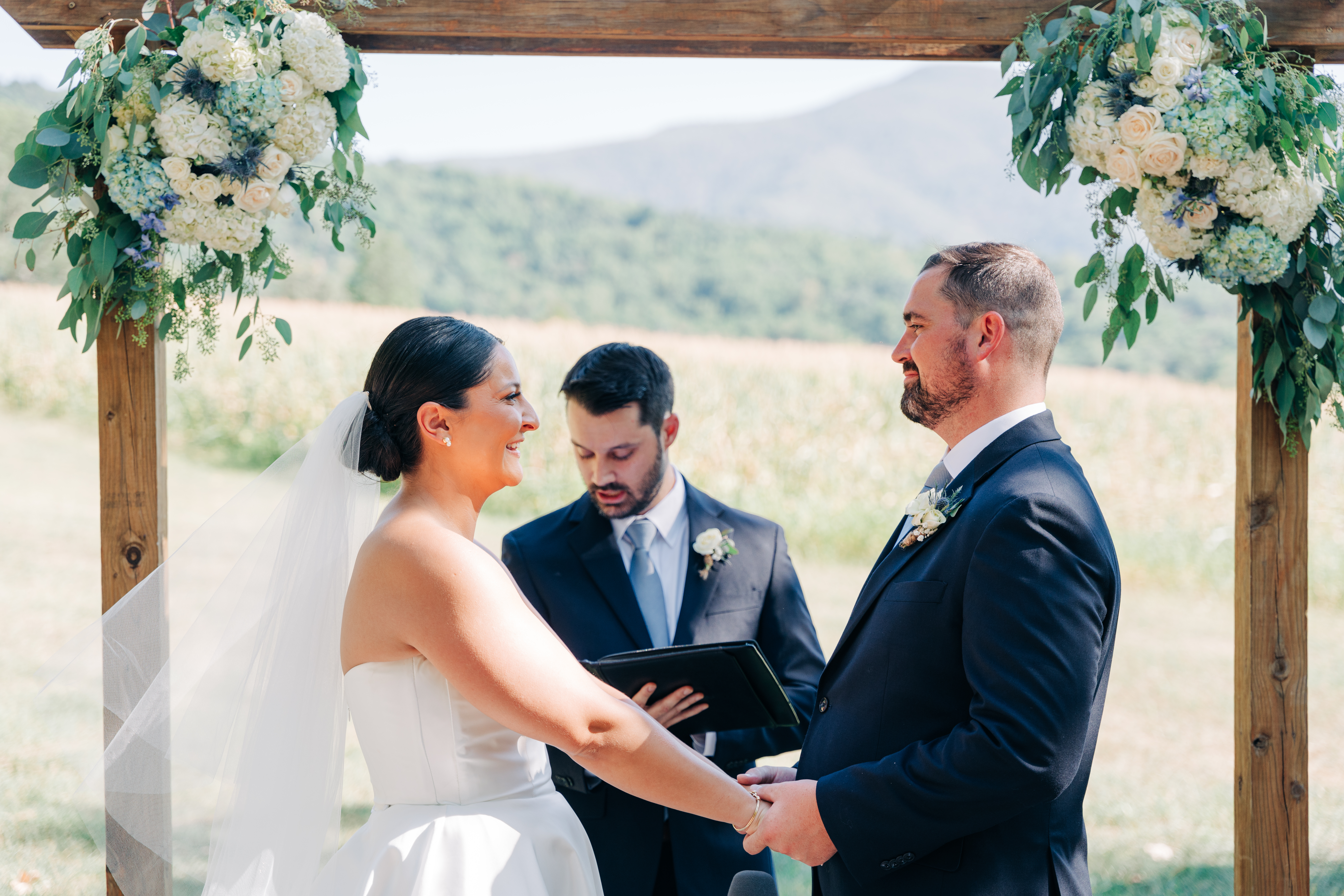Bride and groom at the altar in the Shenandoah Woods by Virginia Wedding Company