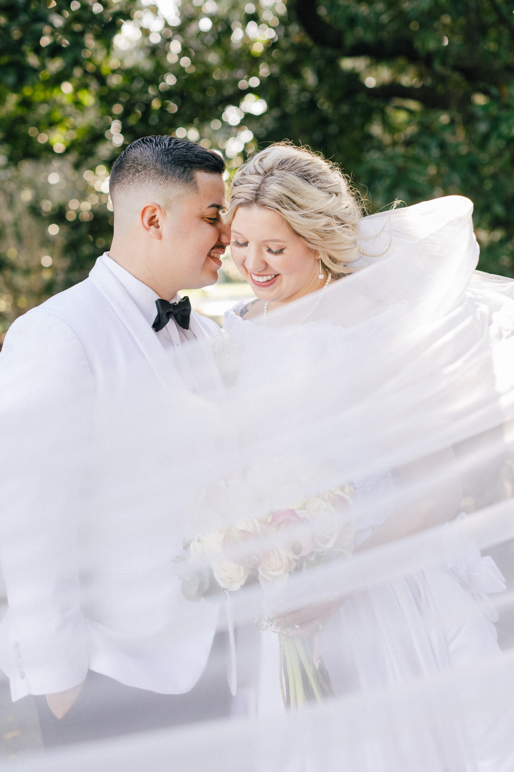 Groom leaning into bride by Virginia Wedding Company