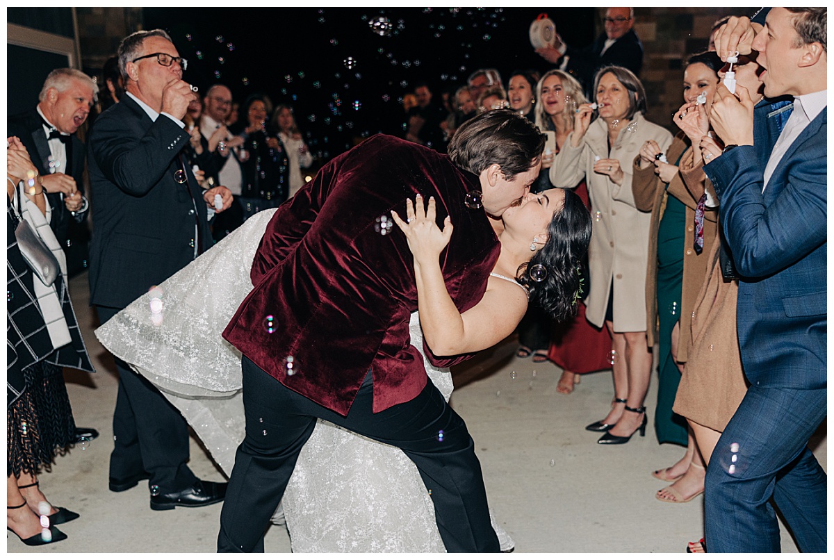 Bride and groom exit kiss by Virginia Wedding Company