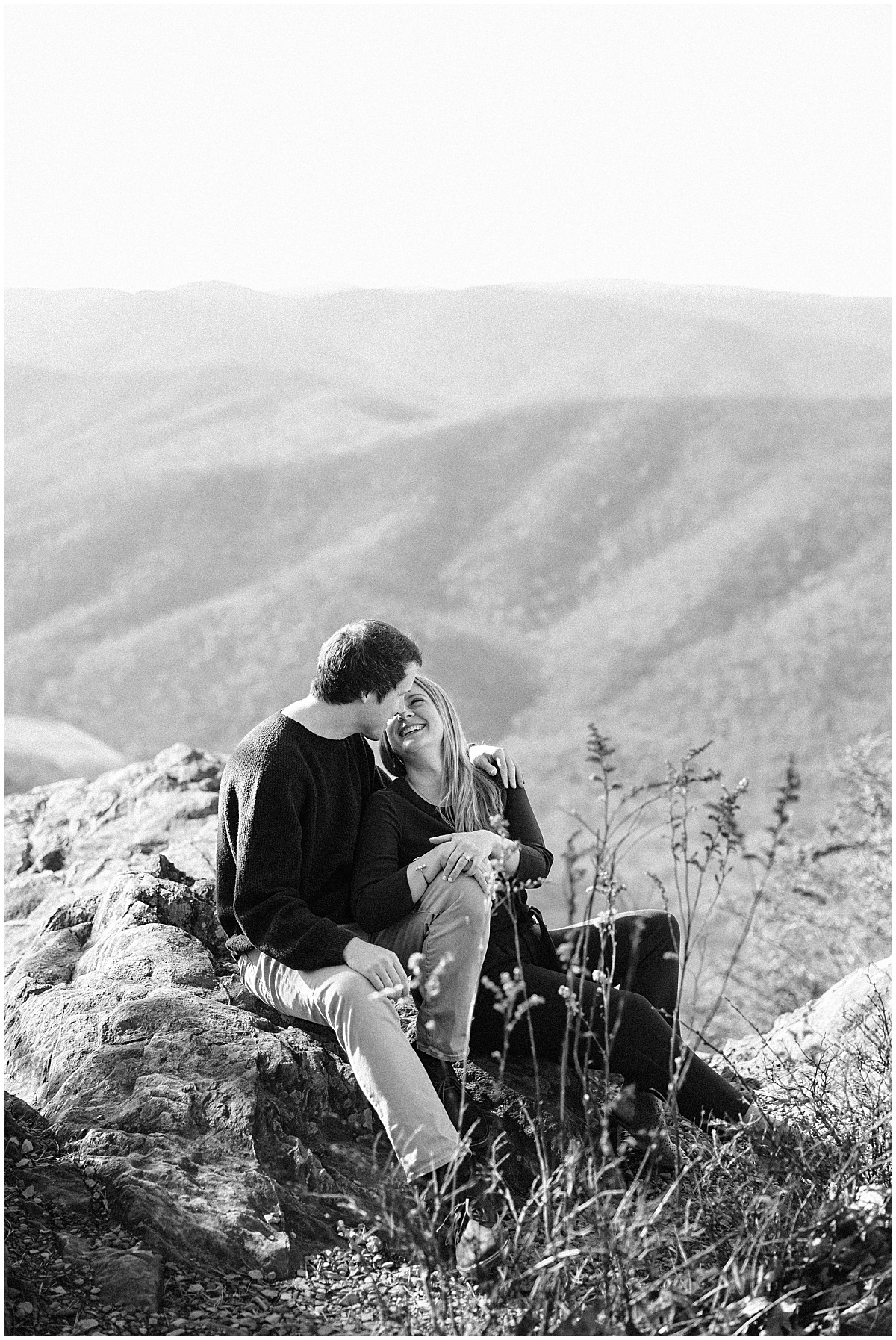 Couple leaning in to kiss at the Shenandoah Valley Overlook by Virginia Wedding Company