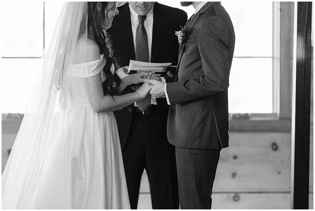 Bride and groom at the alter by Virginia Wedding Company