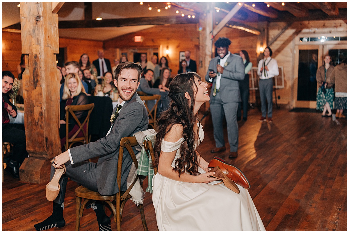 Bride and groom playing a game by Virginia Wedding Company