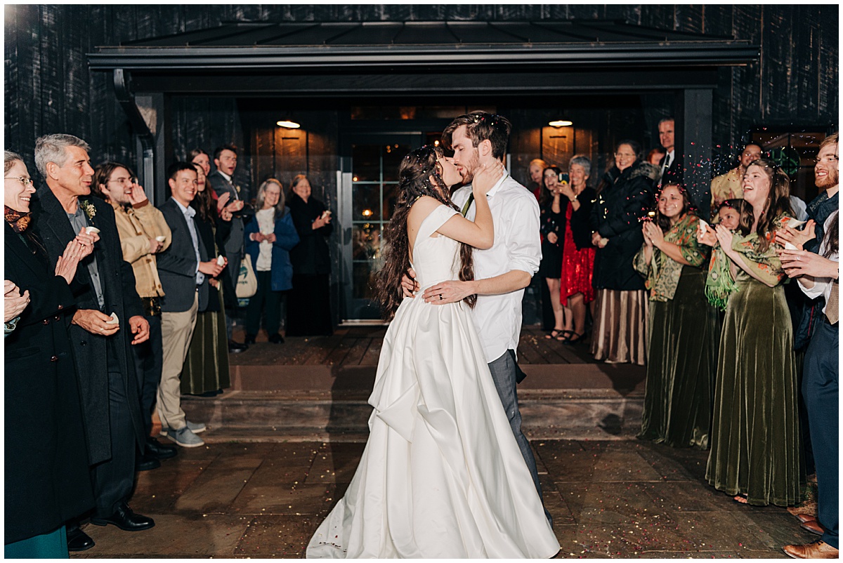 Bride and groom exit kiss by Virginia Wedding Company