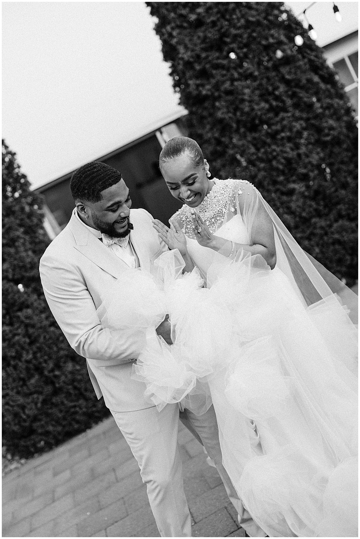 bride and groom laughing