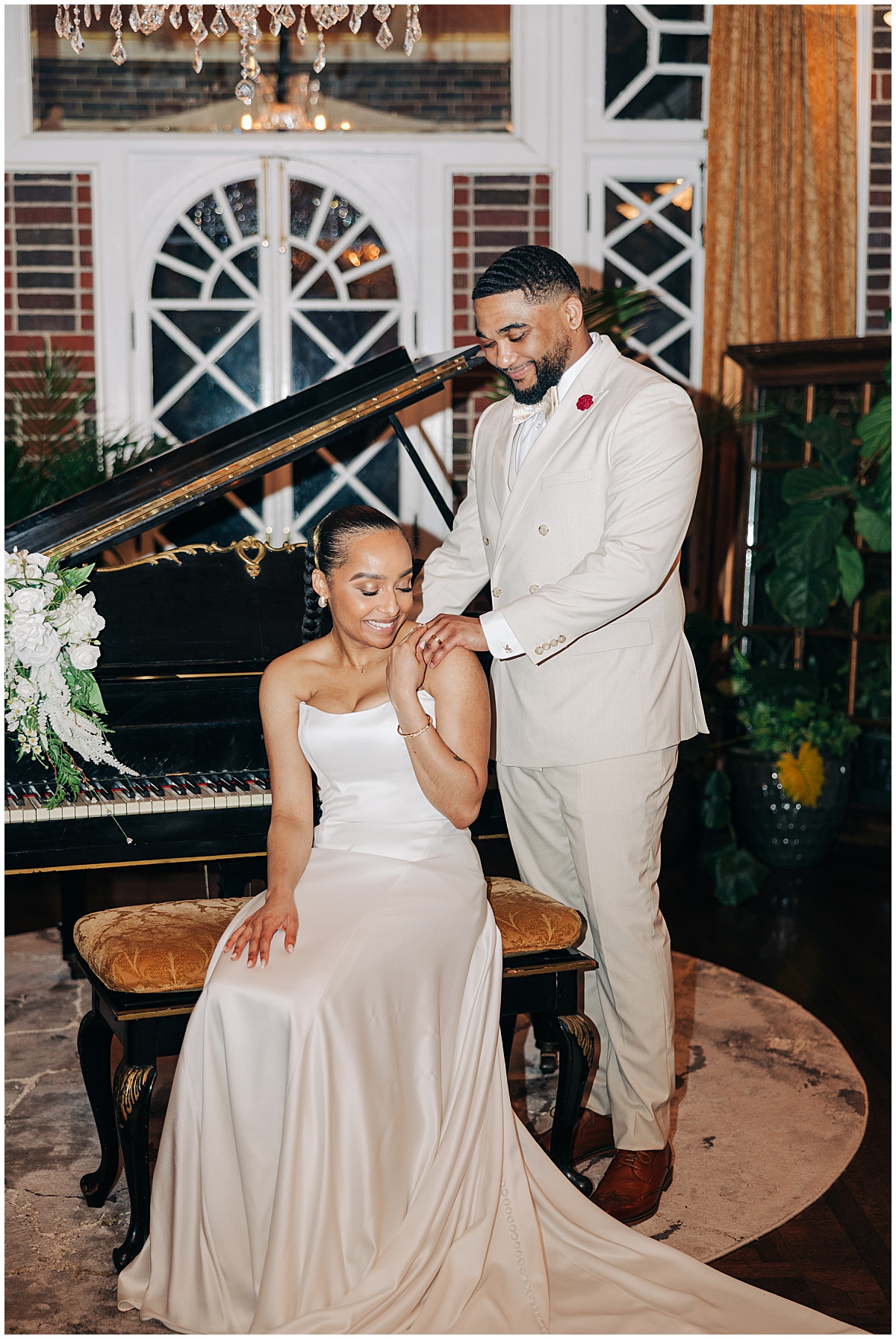 bride and groom by piano