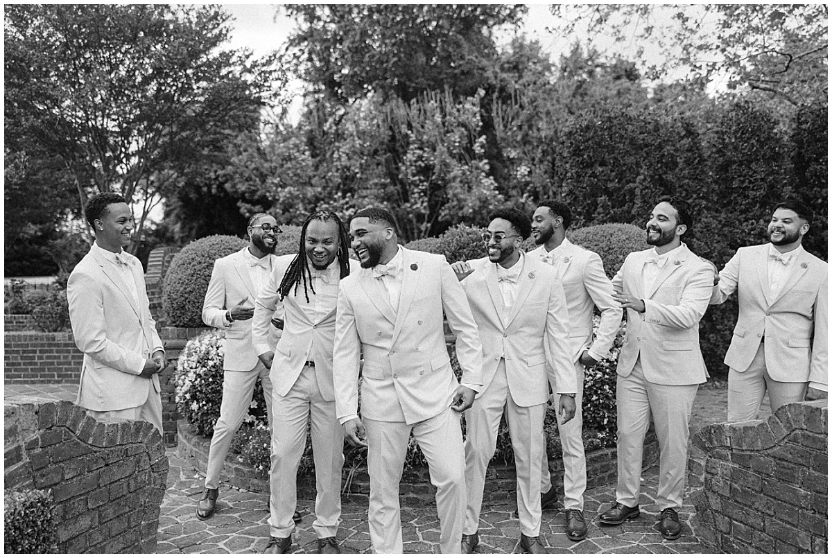 groom with groomsmen laughing