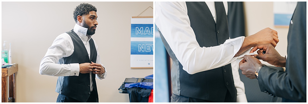 groom buttoning up suit