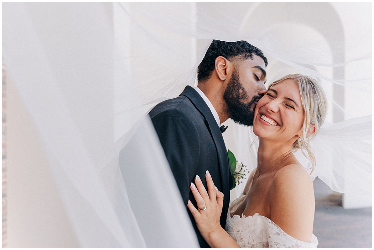 groom kissing bride