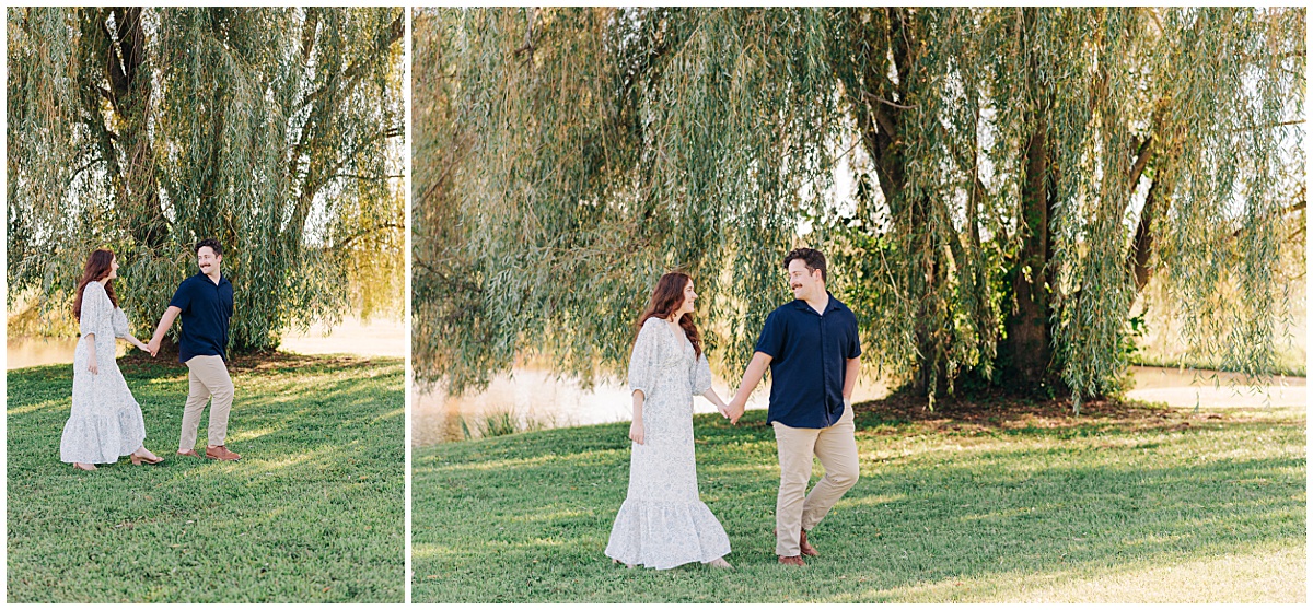 couple walking under trees with guy leading