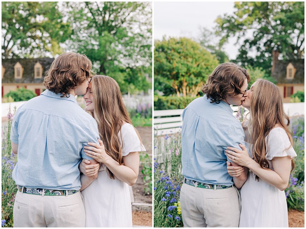 couple kissing in front of flower garden at colonial williamsburg